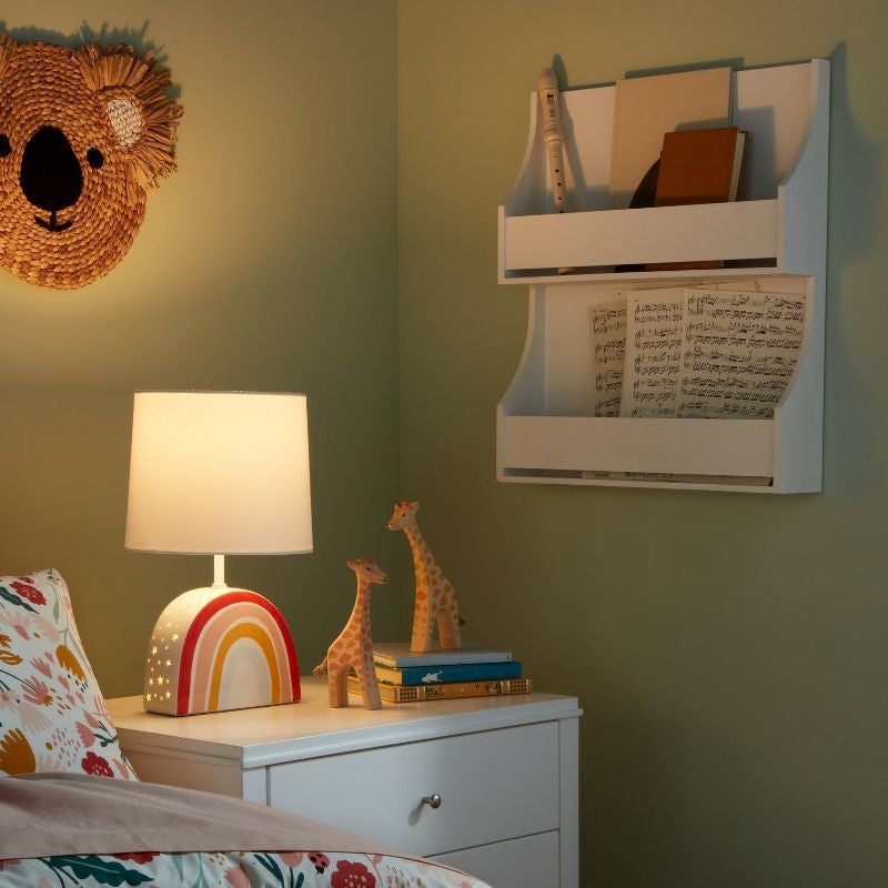 rainbow lamp on a kid's bedside table