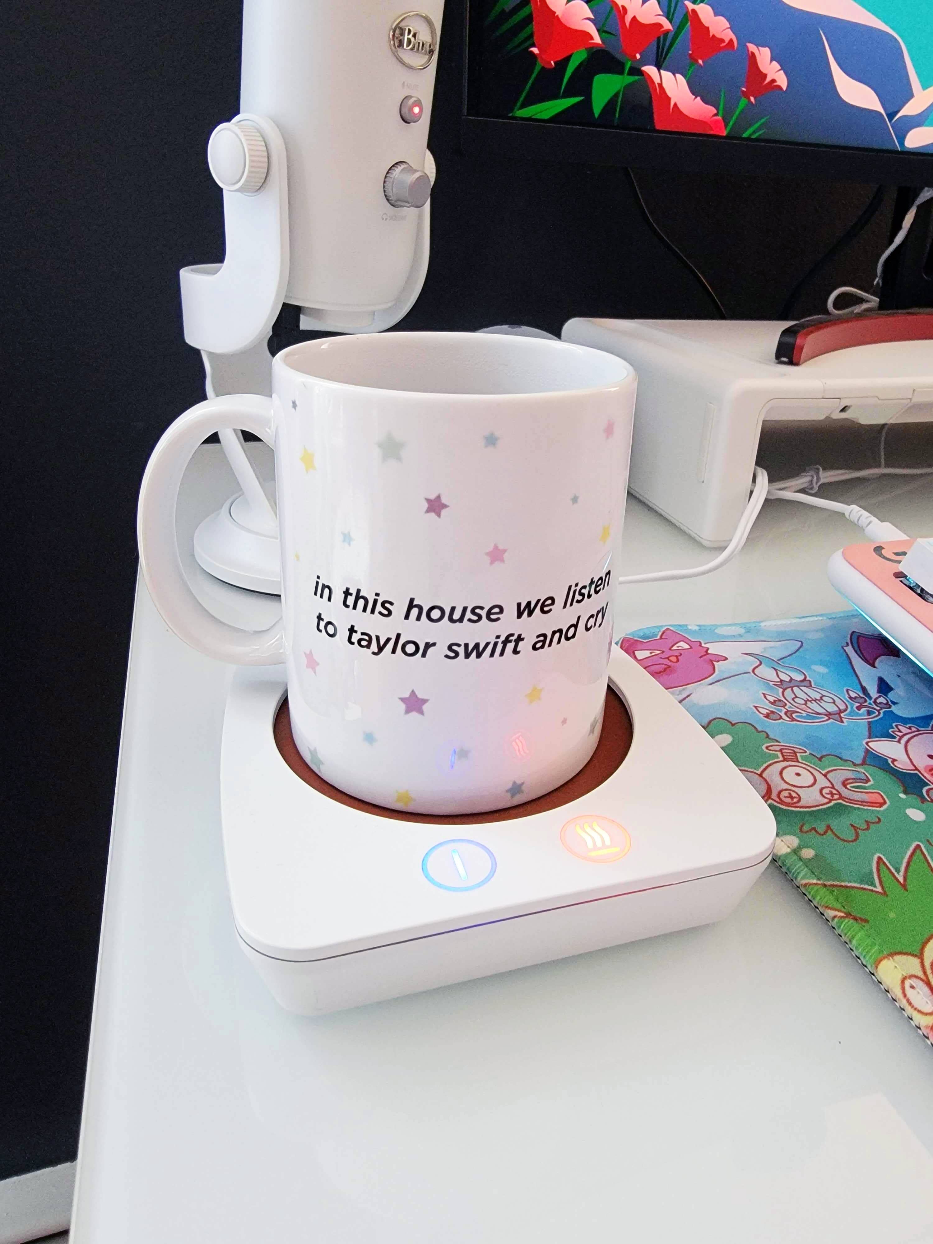 a buzzfeed editor's mug on a mug warmer