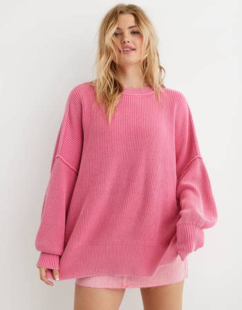 model wearing the sweater in pink