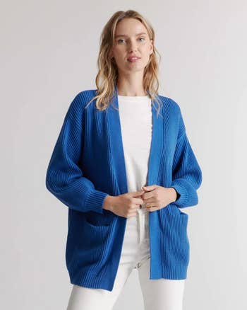 model in blue oversized cardigan