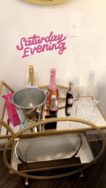 reviewer's cart loaded with wine with Instagram story sticker that says 