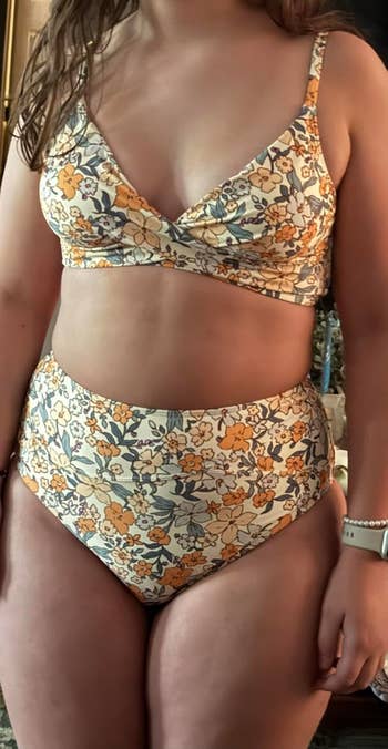 Person wearing a floral bikini acceptable   and a wristwatch, showcasing swimwear benignant   for a buying  article