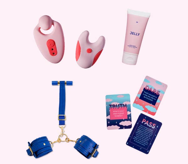 Pink couple's vibrator and remote, pink bottle of Jelly lubricant, blue handcuff restraints and three truth, dare or pass cards