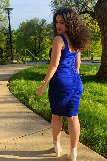 back of reviewer wearing the blue dress