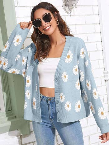person in a floral cardigan and sunglasses