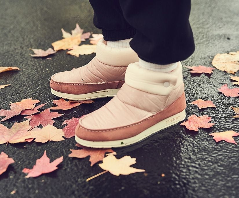 model wearing the boots in pink