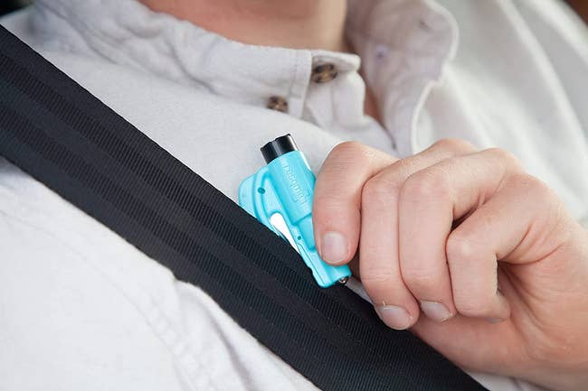 the keychain car   flight  instrumentality   utilized  to chopped  a seatbelt