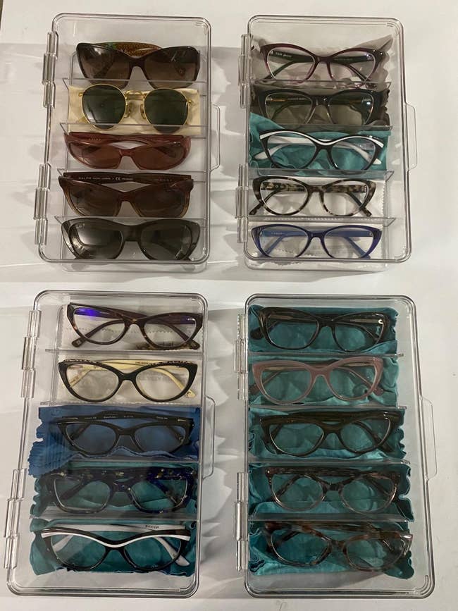 A reviewer's glasses and sunglasses neatly organized in eye wear organizers