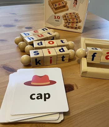 reviewer image of card showing a cap and wooden rolling spell board