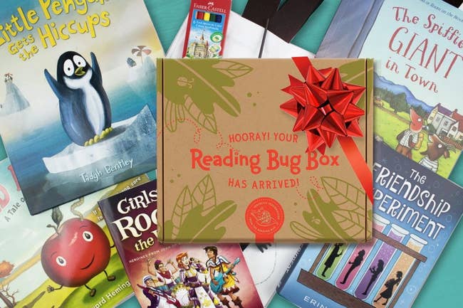 various children's books surrounding a reading bug box 