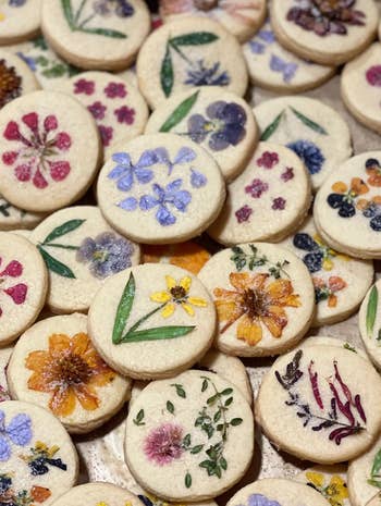 short bread cookies with pressed flowers inside 