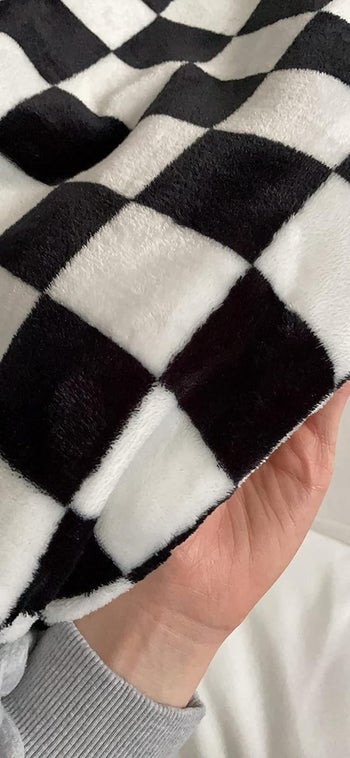 reviewer image of a close up of a black and white checkered blanket
