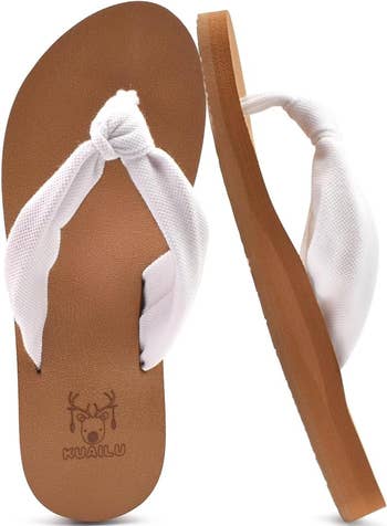 Pair of flip-flops with white cloth straps 