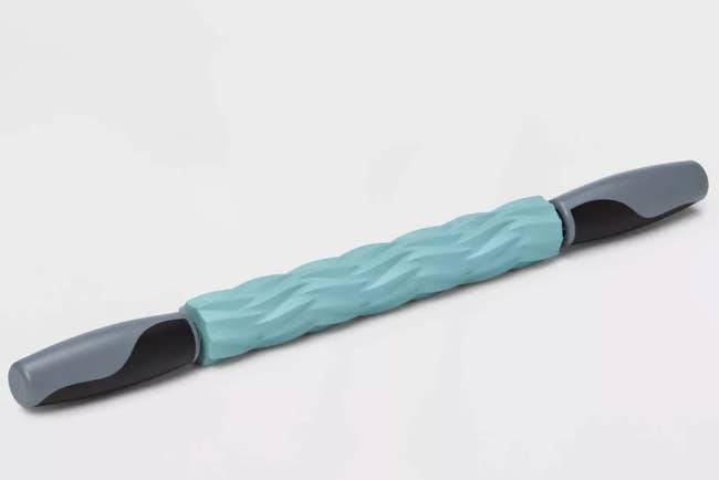 Handheld musculus roller with contoured handles and textured grip, perfect for massage and hostility alleviation successful a fittingness oregon wellness routine