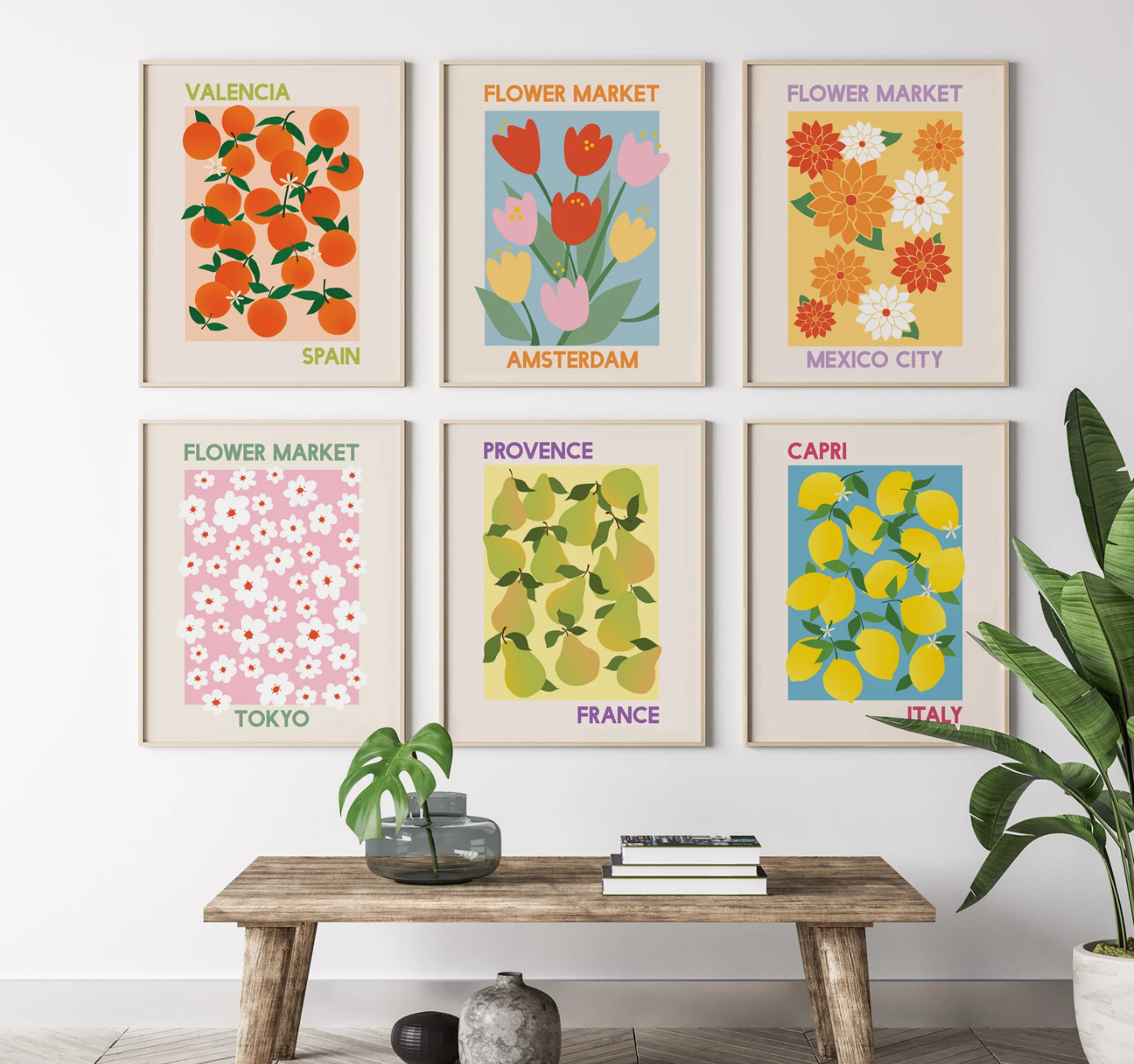 colorful digital art prints with global flowers and fruits in square frames behind wooden bench