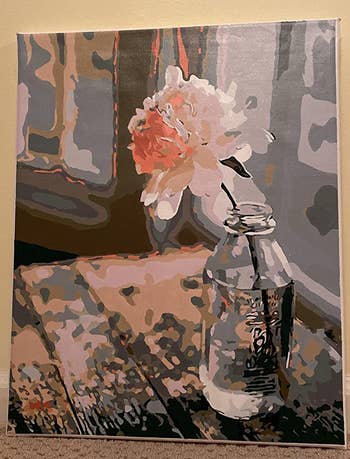 reviewer painting of a flower sitting in a glass vase of water
