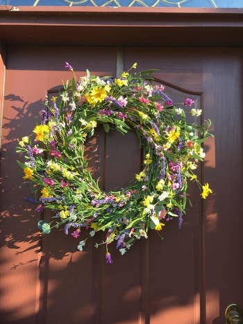 a wreath hanging on a door