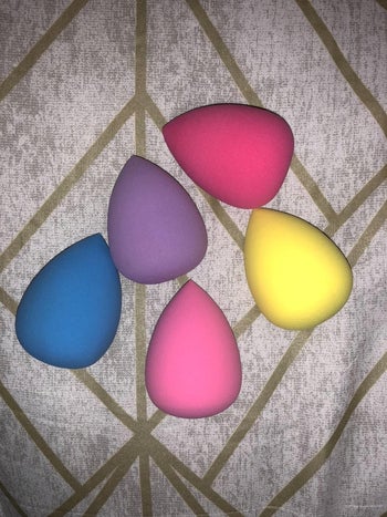 set of pink, purple, blue, and yellow makeup sponges