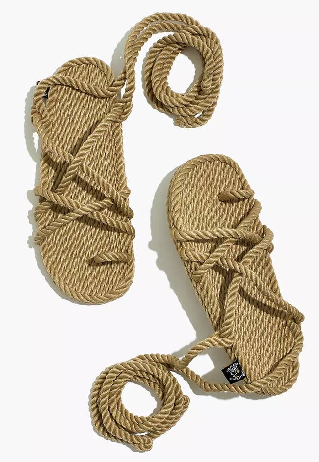 Brown rope tie up gladiator sandals on a white background