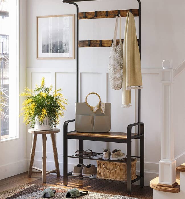 the coat and shoes storage rack in an entryway