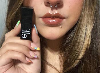 reviewer holding and wearing the cinnamon dreamz shade