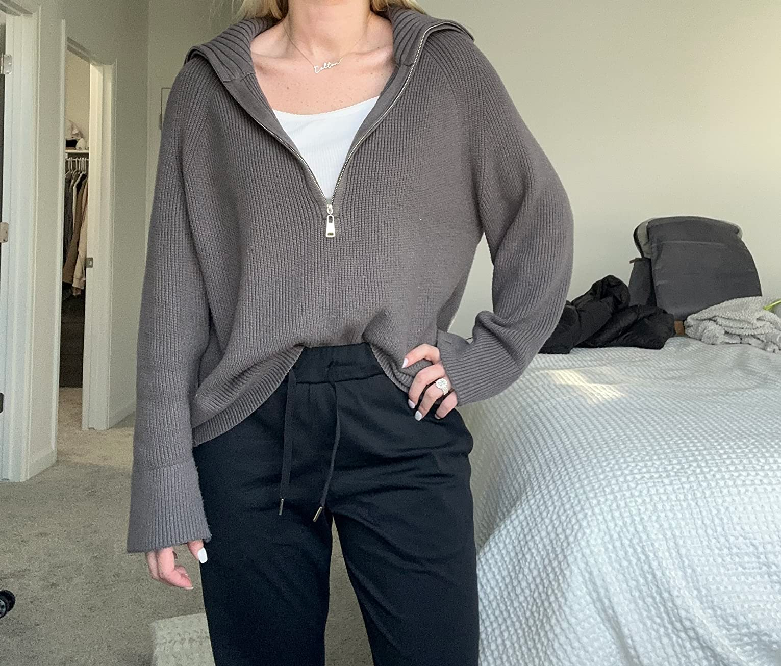 a reviewer wearing the sweater. successful  grey  