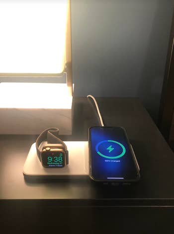 pic of silver Base One Max charging station with iPhone and Apple Watch on top