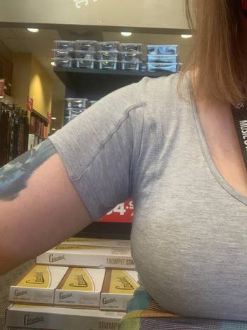 reviewer wearing airy  grey mentation    of top