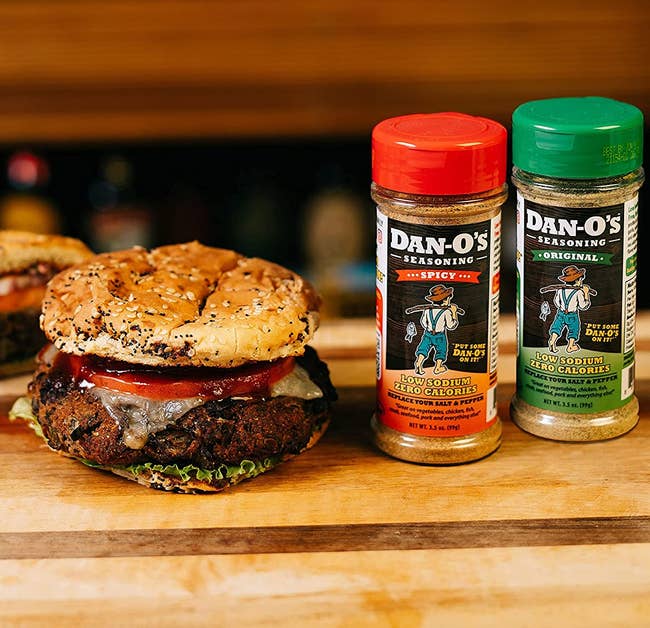 the original and spicy seasonings next to a burger