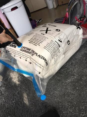 Vacuum-sealed retention  container  filled with a comforter
