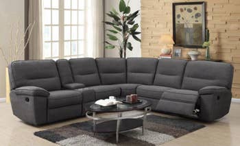 lifestyle photo of the gray reclining sectional sofa in living room