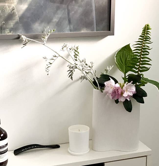 reviewer image of the white vase with flowers in it