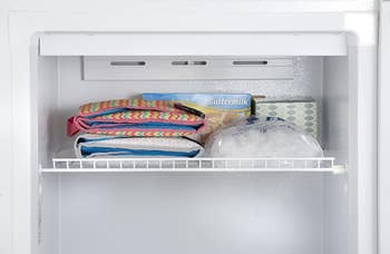 two of the car seat coolers folded up placed in a freezer