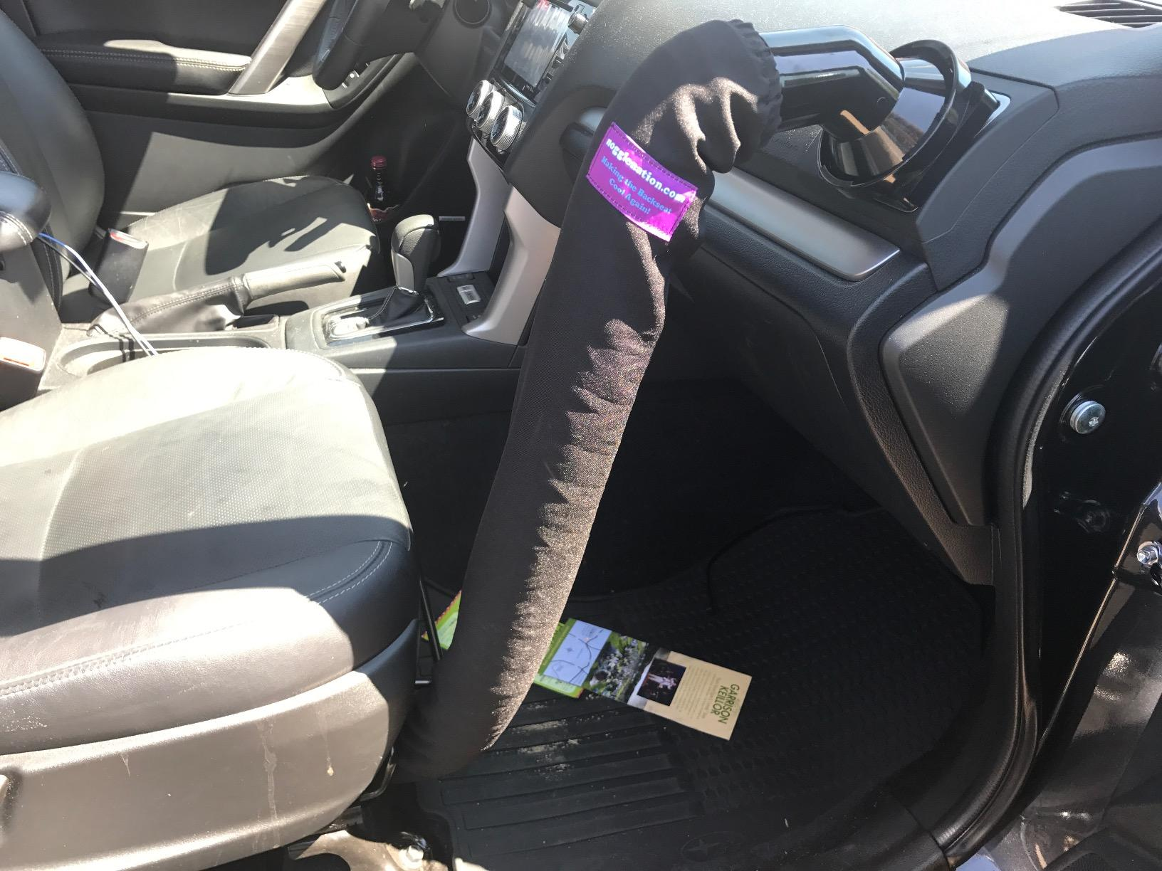 a reviewer's car with the tube attached to the vent