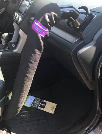 a reviewer's car with the tube attached to the vent