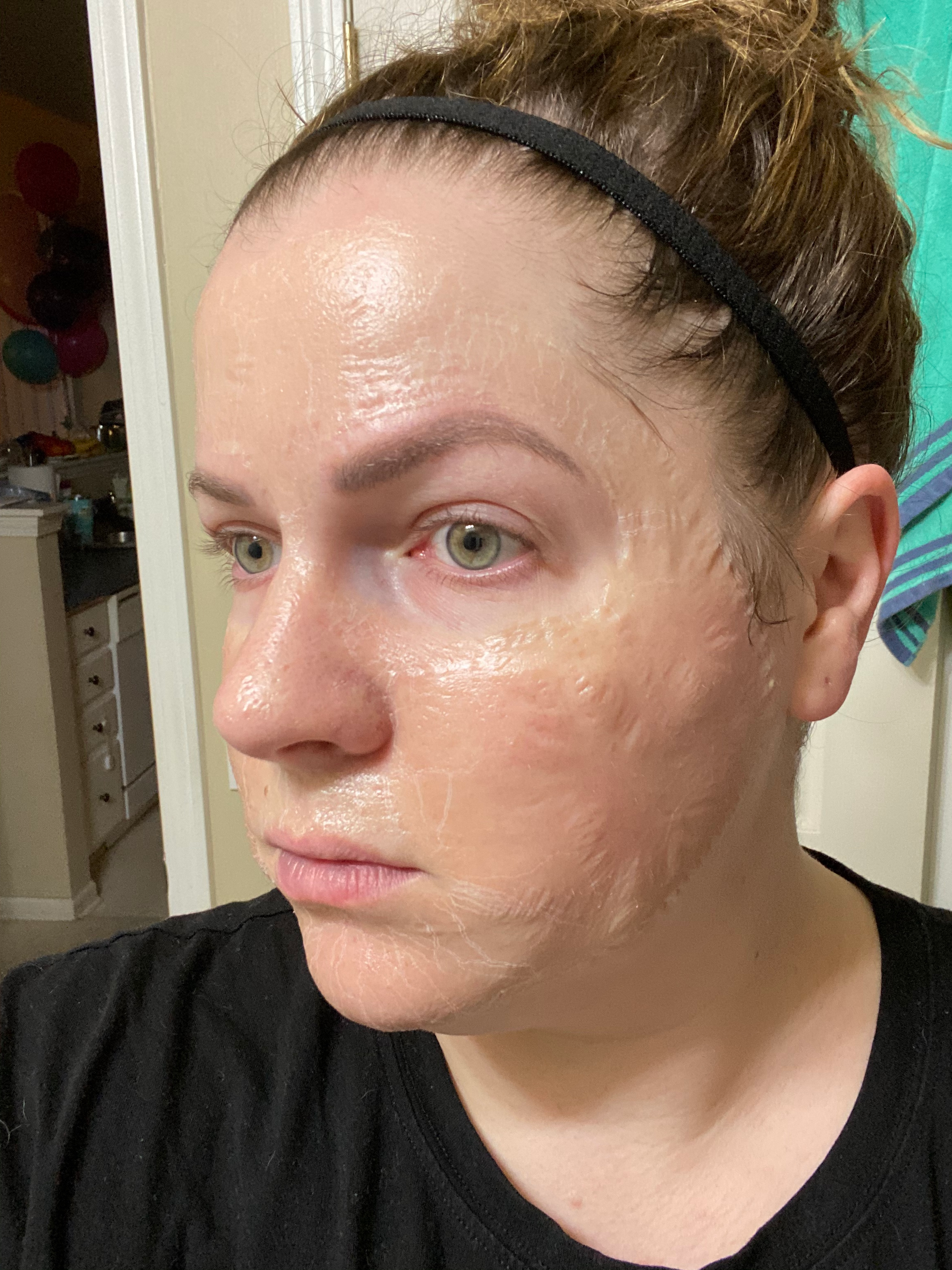 reviewer wearing zombie mask giving appearance skin is peeling off