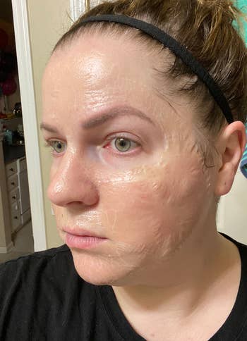 reviewer wearing zombie mask giving appearance skin is peeling off