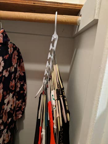 The same hanger folded down to show how those five hangers can be condensed and take up less space