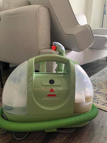 reviewer's small green upholstery cleaner