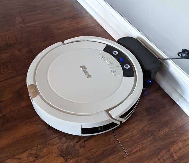 reviewer image of the round robot vacuum in white