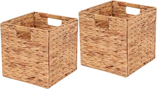 Two woven storage baskets with integrated handles, ideal for organizing household items