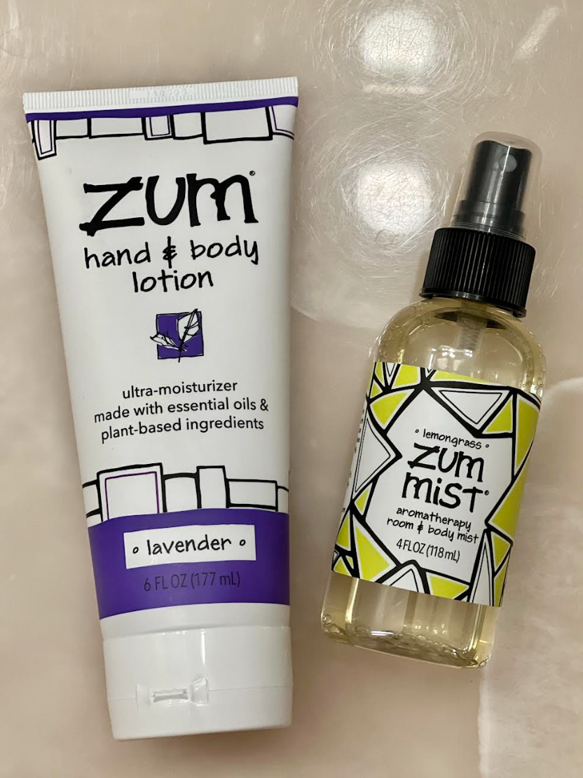Zum hand & body lotion container next to Zum aromatherapy room & body mist