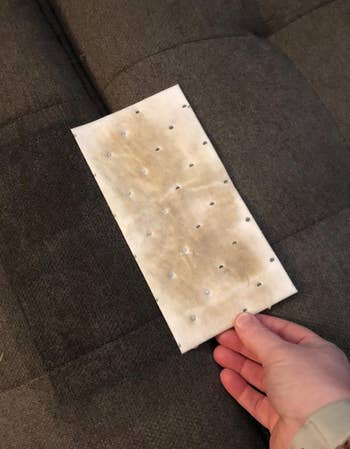 a reviewer photo of a used stain lifting pad 