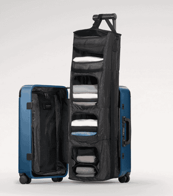 Expandable suitcase with built-in shelves, showcasing organized clothes