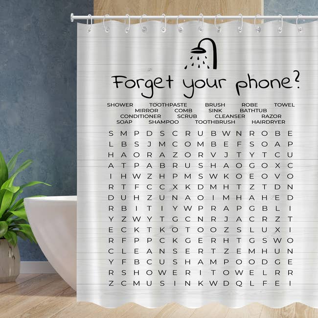 Shower curtain with a word search game and bathroom-related items listed