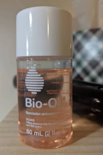 Bio-Oil skincare vessel  connected  a shelf, labeled for scar and tegument  improvement, 60 mL size