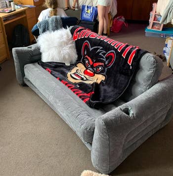reviewer photo of the sofa in a dorm room