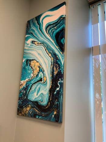 reviewer's blue, white, and gold marble painting