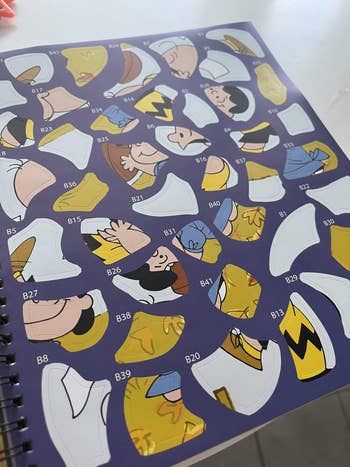 Puzzle pieces featuring cartoon quality outfits and faces connected a sheet, with letters and numbers labeling each piece