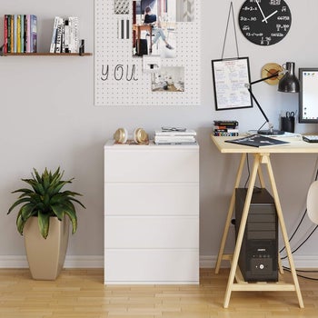 minimalist white four-drawer dresser in home office